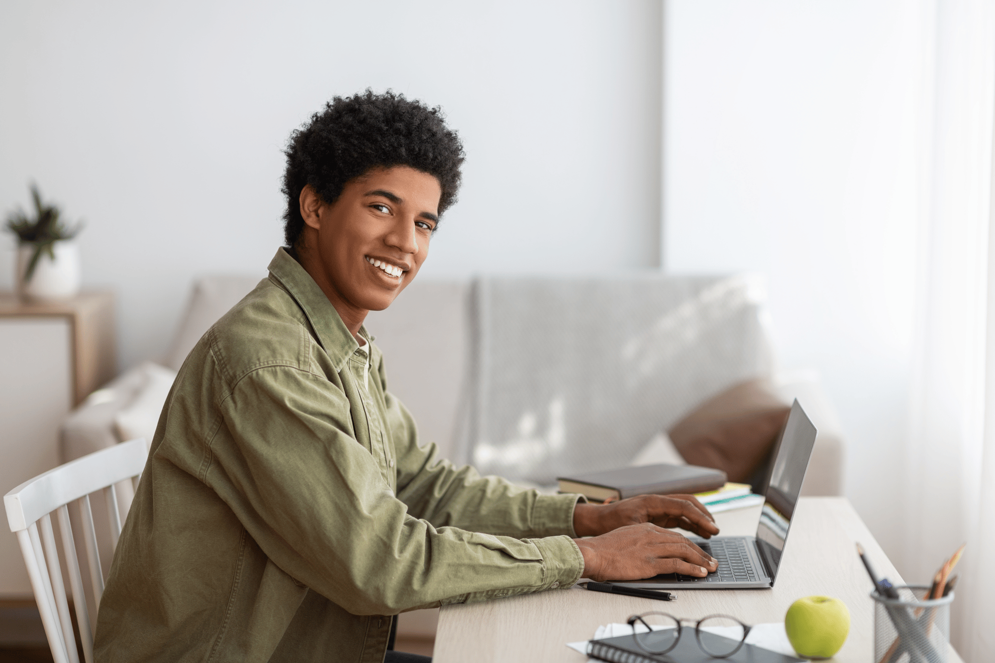 smiling-indian-businesswoman-in-headset-sits-at-la-2